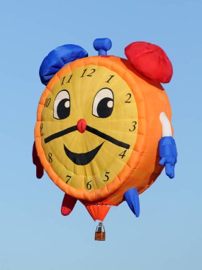 Large colorful hot air balloon in the shape of a clock