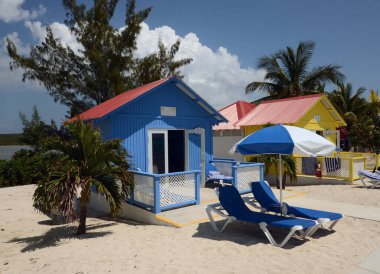 Colorful beach bungalows on a tropical island of the Bahamas