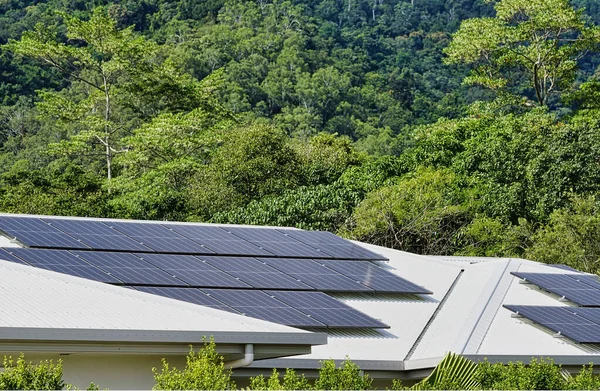 Solar Panels Roof House Rainforest Background — Zdjęcie stockowe