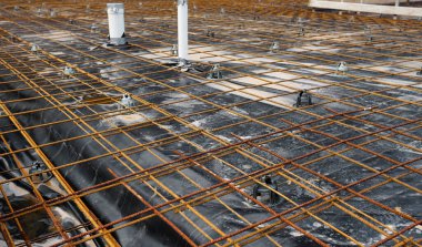 preparing the formwork for the foundation of a new house with metal rods and mesh