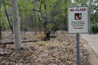 no glass bottle or container sign with bush background