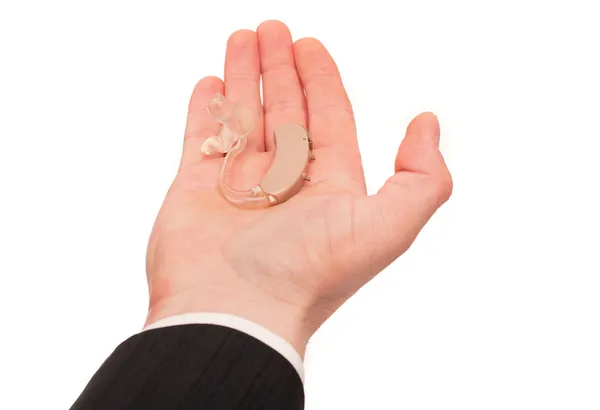 Hearing aid on palm — Stock Photo, Image