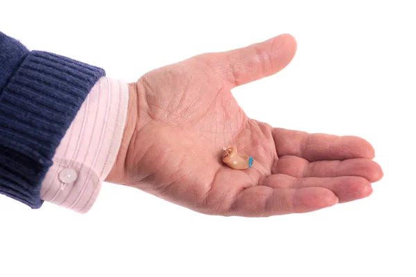 Hand with hearing aid — Stock Photo, Image