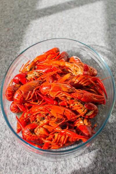 Red boiled crawfish in clear glass bowl — Stock Photo, Image