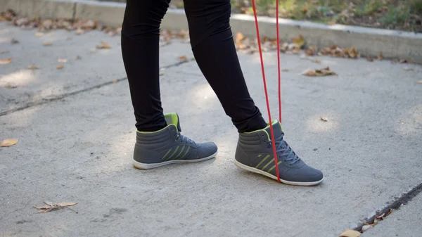 Woman with skipping rope — Stock Photo, Image