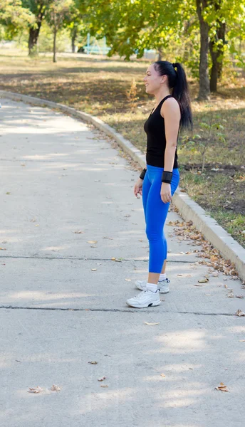 Athletic shapely woman in sportswear — Stock Photo, Image