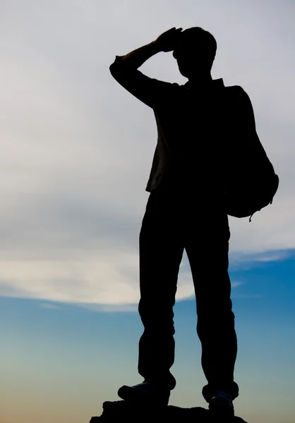 Man standing on top of a rock — Stock Photo, Image