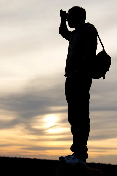 Silhouette of a man looking into distance — Stock Photo, Image