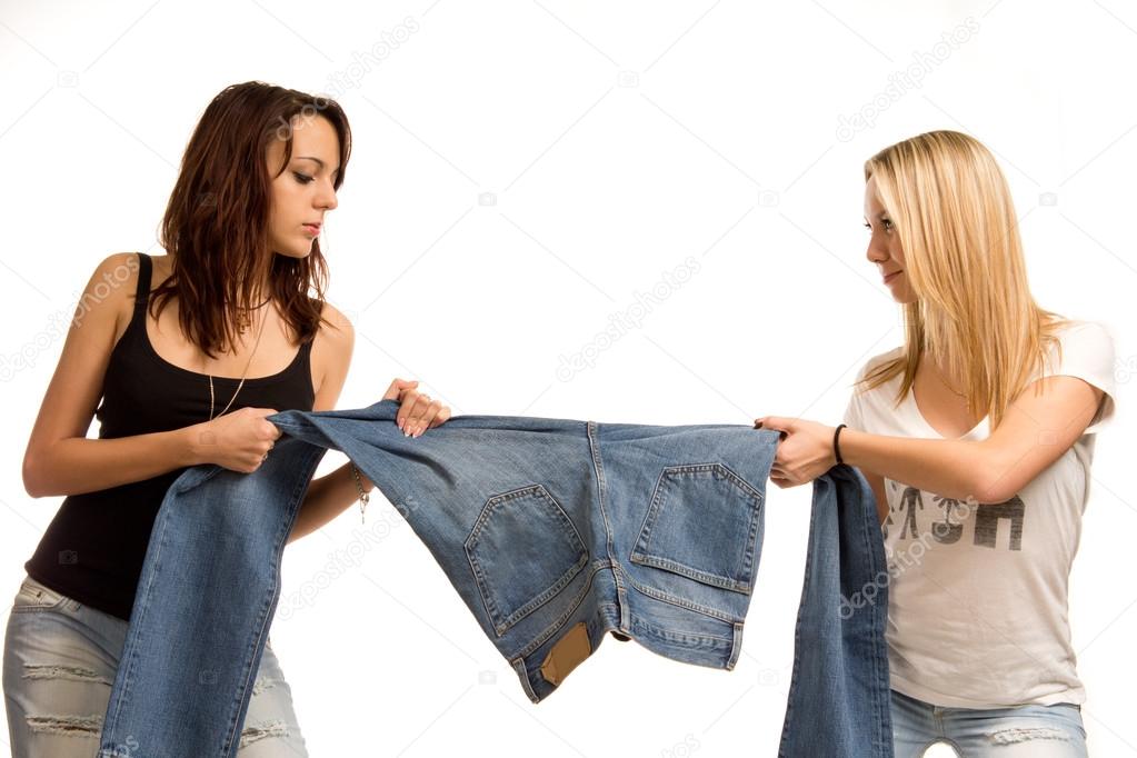 Two teenagers fighting over jeans