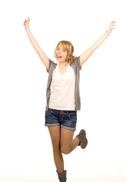 Young blonde woman jumping for joy — Stock Photo, Image