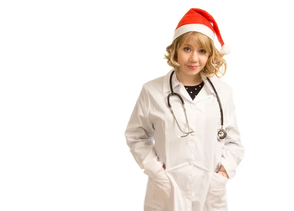 在圣诞老人帽子漂亮女医生 — 图库照片