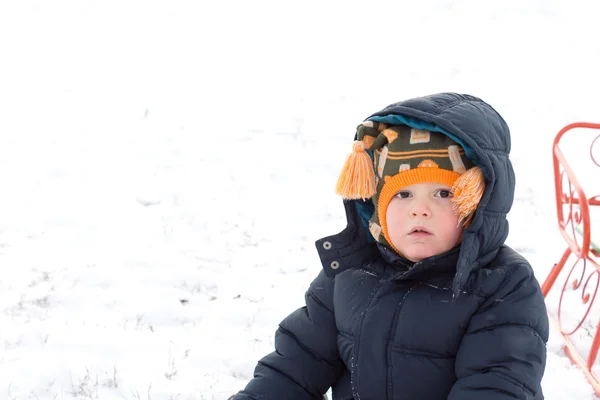 Serious little boy in winter snow — Stock Photo, Image