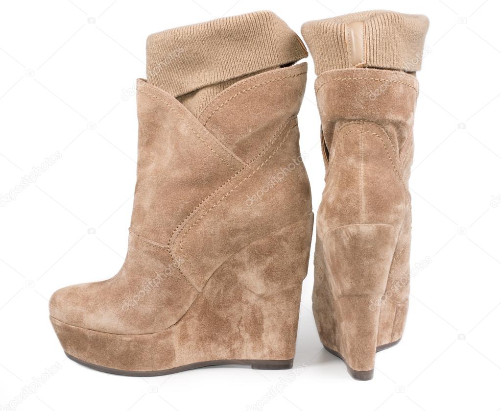 Pair suede boots with integral legging