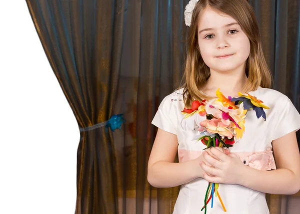 Little girl posing with flowers — Stock Photo, Image