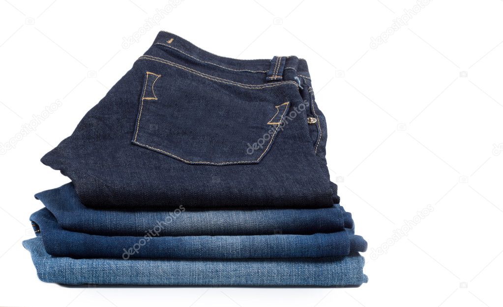 Pile of denim jeans