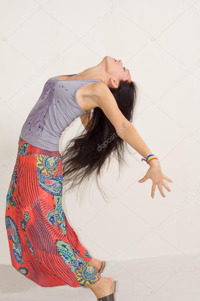Agile young woman arching her back