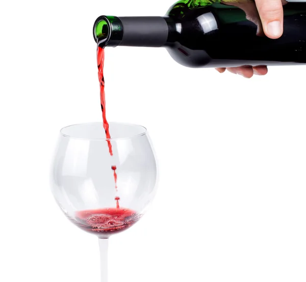 Pouring red wine into a wineglass — Stock Photo, Image