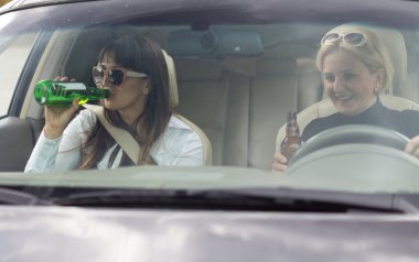 Women partying and drinking while driving clipart