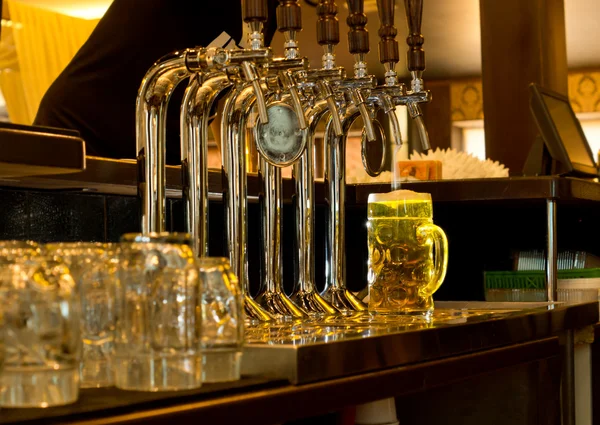 Tankard of draught beer in a pub — Stock Photo, Image