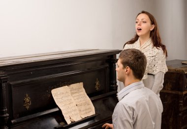 Young couple giving a singing recital