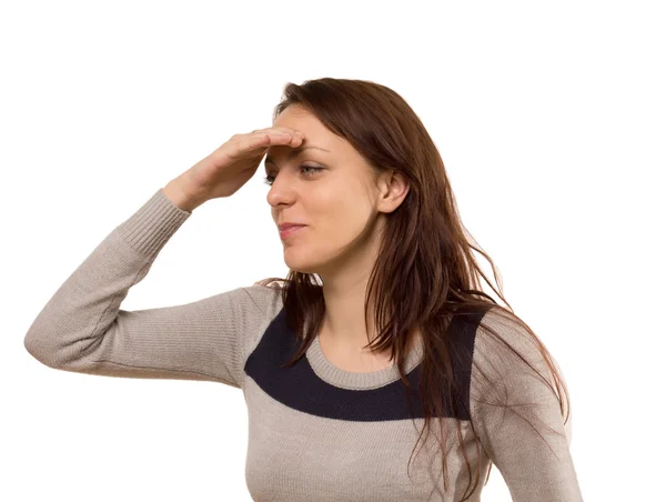 Young woman smiling as she peers into the distance — Stock Photo, Image