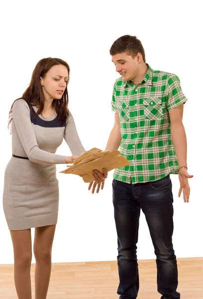 Woman accusing her boyfriend pointing to papers — Stock Photo, Image