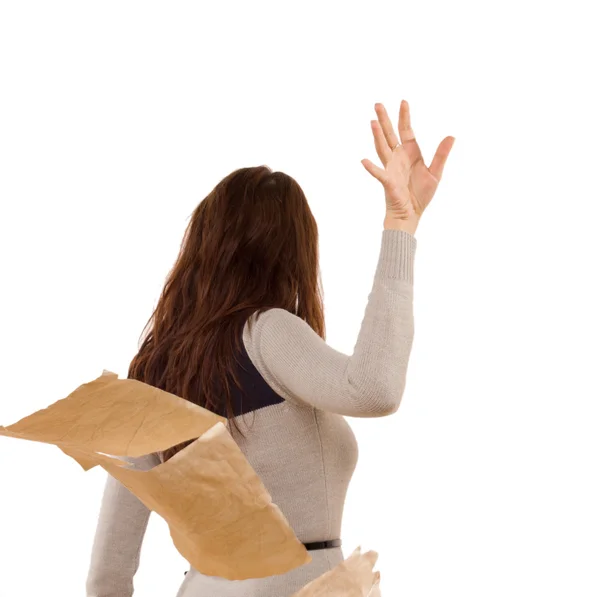 Woman tossing aside papers in anger — Stock Photo, Image