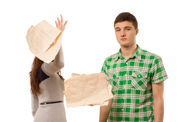 Young woman tossing aside papers — Stock Photo, Image