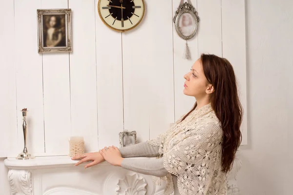 Nostalgic woman looking at an old family portrait — Stock Photo, Image