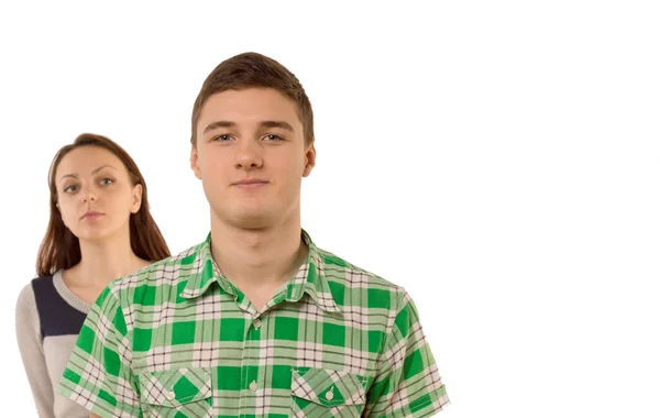 Smug young man being watched by his girlfriend — Stock Photo, Image