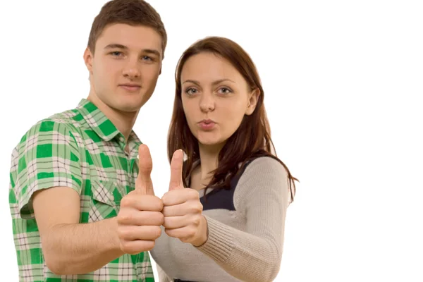 Motivada joven pareja dando un pulgar hacia arriba — Foto de Stock