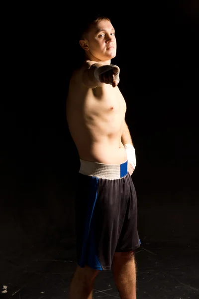 Muscular young boxer pointing at the camera — Stock Photo, Image