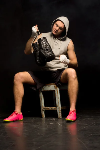 Boxer preparing for a fight checking his gloves — Stock Photo, Image