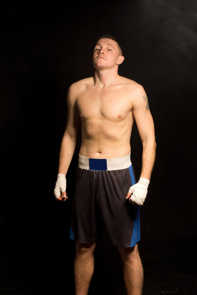 Young boxer breathing deeply before a fight