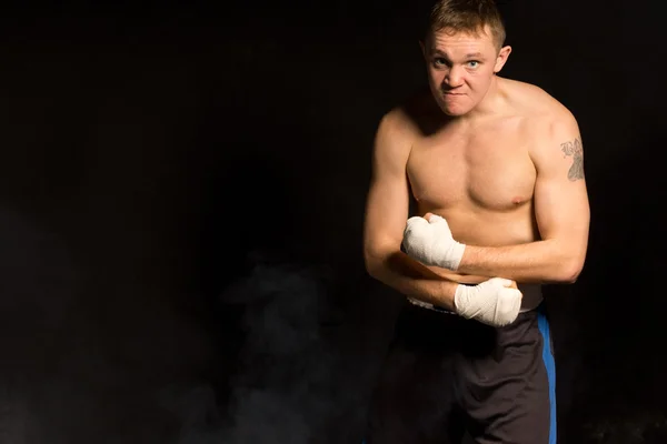 Strong muscular young boxer — Stock Photo, Image