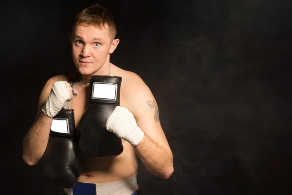 Serious resolute young boxer — Stock Photo, Image