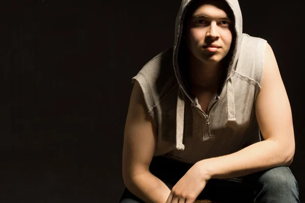 Atmospheric dark portrait of a fit young man — Stock Photo, Image