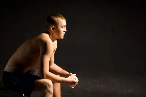 Handsome shirtless man lost in thought — Stock Photo, Image