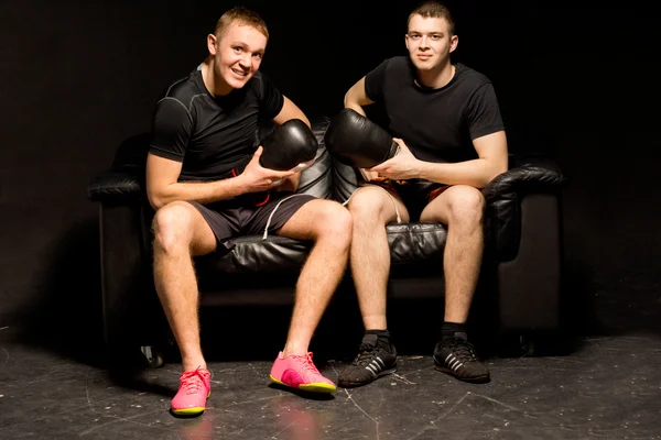 Two smiling friendly boxers sitting together — Stock Photo, Image