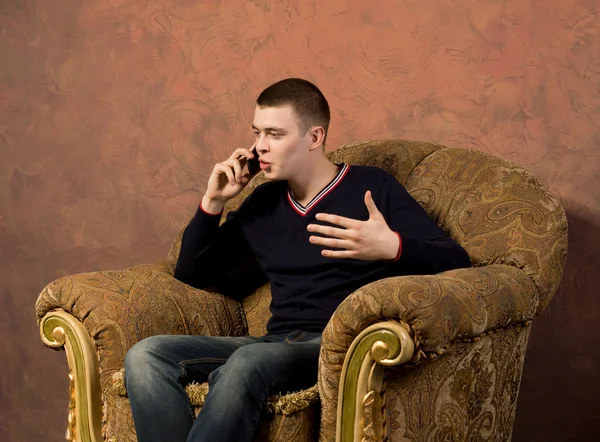 Young man having an animated conversation — Stock Photo, Image