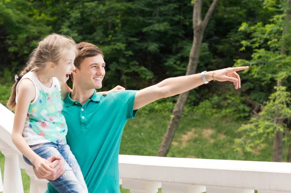 Young man pointing out something for his sister — Stock Photo, Image