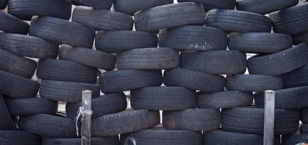 Stacked tires forming a safety barrier — Stock Photo, Image