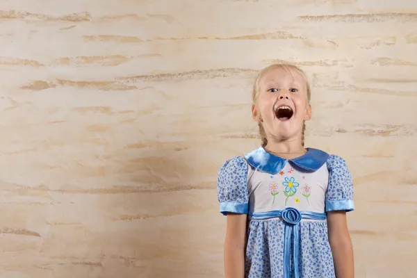 Happy Young Girl Isolated on Wooden Wall — Stock Photo, Image