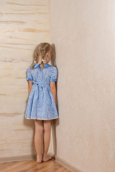 Little girl being punished standing in the corner — Stock Photo, Image