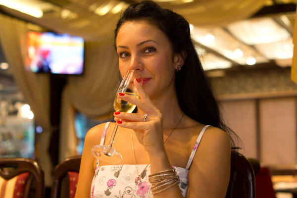 Beautiful woman sipping champagne
