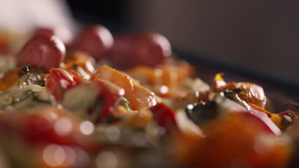 Close up on savory dish with veggies, cheese and Wieners — Stock Video