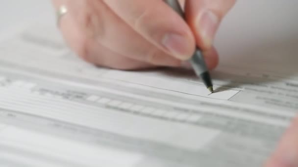 Man completing a form or signing a legal document — Stock Video