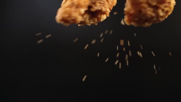 Freeze Motion Close Two Deep Fried Chicken Pieces Dark Background — Stock videók