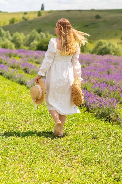Blond Woman White Summer Dress Walking Away Camera Alongside Field — Stockfoto