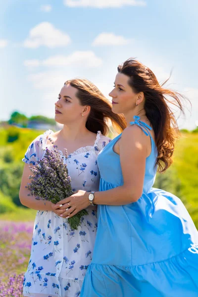 Two Women Friends Posing Together Windy Summer Day Outdoors Lavender — Stok fotoğraf